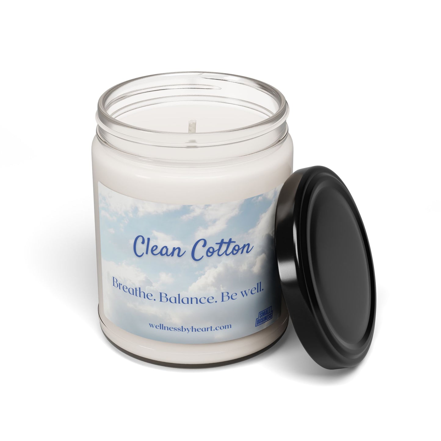 The Clean Cotton Essential Oil Soy Candle's scent profile includes cotton blossom, Lemon on the top with complementing linen and powder, subtle sandalwood and violet base. Lid removed white background